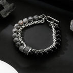 Bracelet with beads and chain on a dark surface