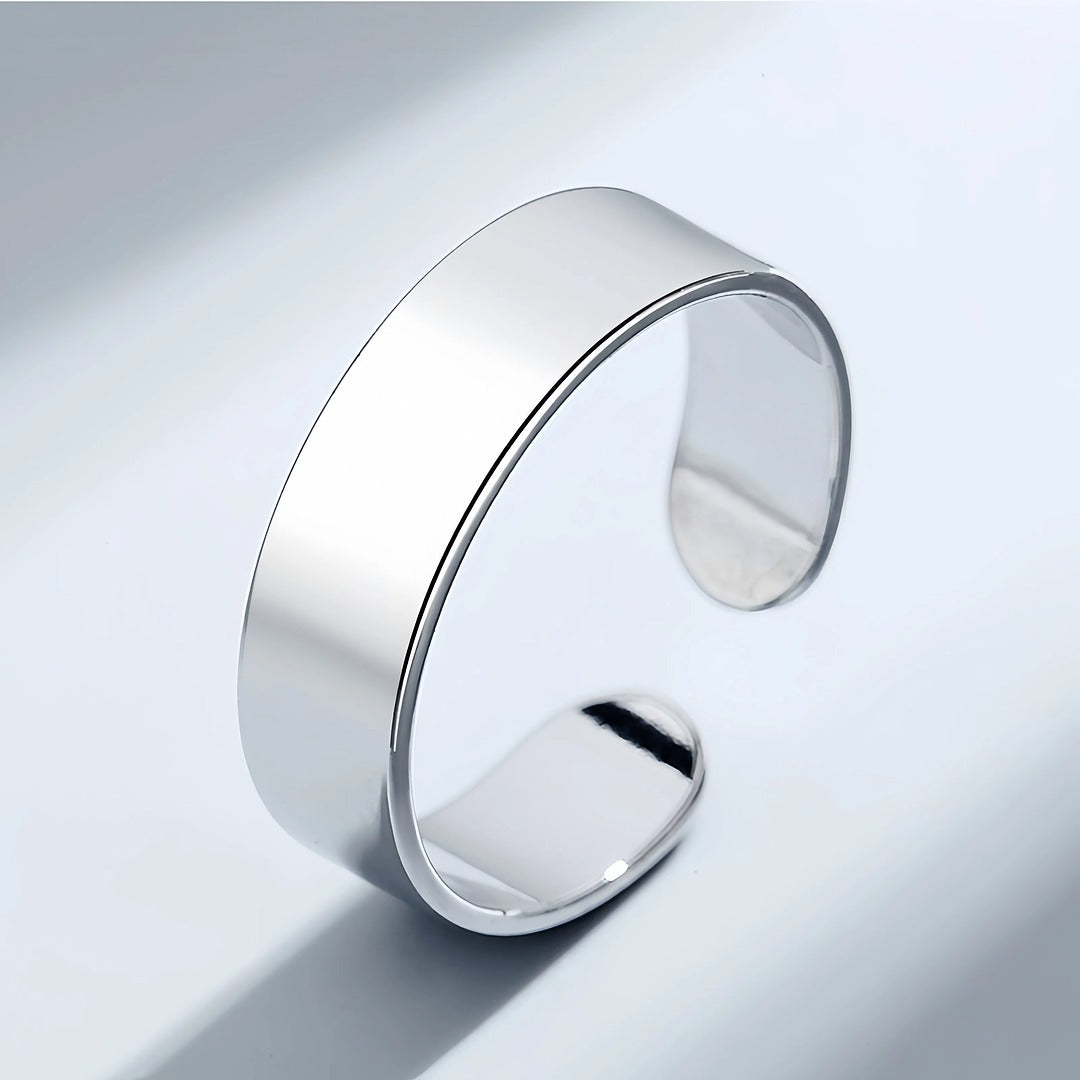 Silver bracelet on a light gray background